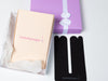 black tummytape pregnancy tape beside purple gift box